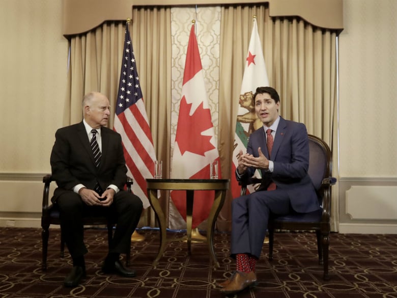 Canada's Prime Minister Justin Trudeau, right, speaks while meeting with California Gov. Jerry Brown in San Francisco, Friday, Feb. 9, 2018. 